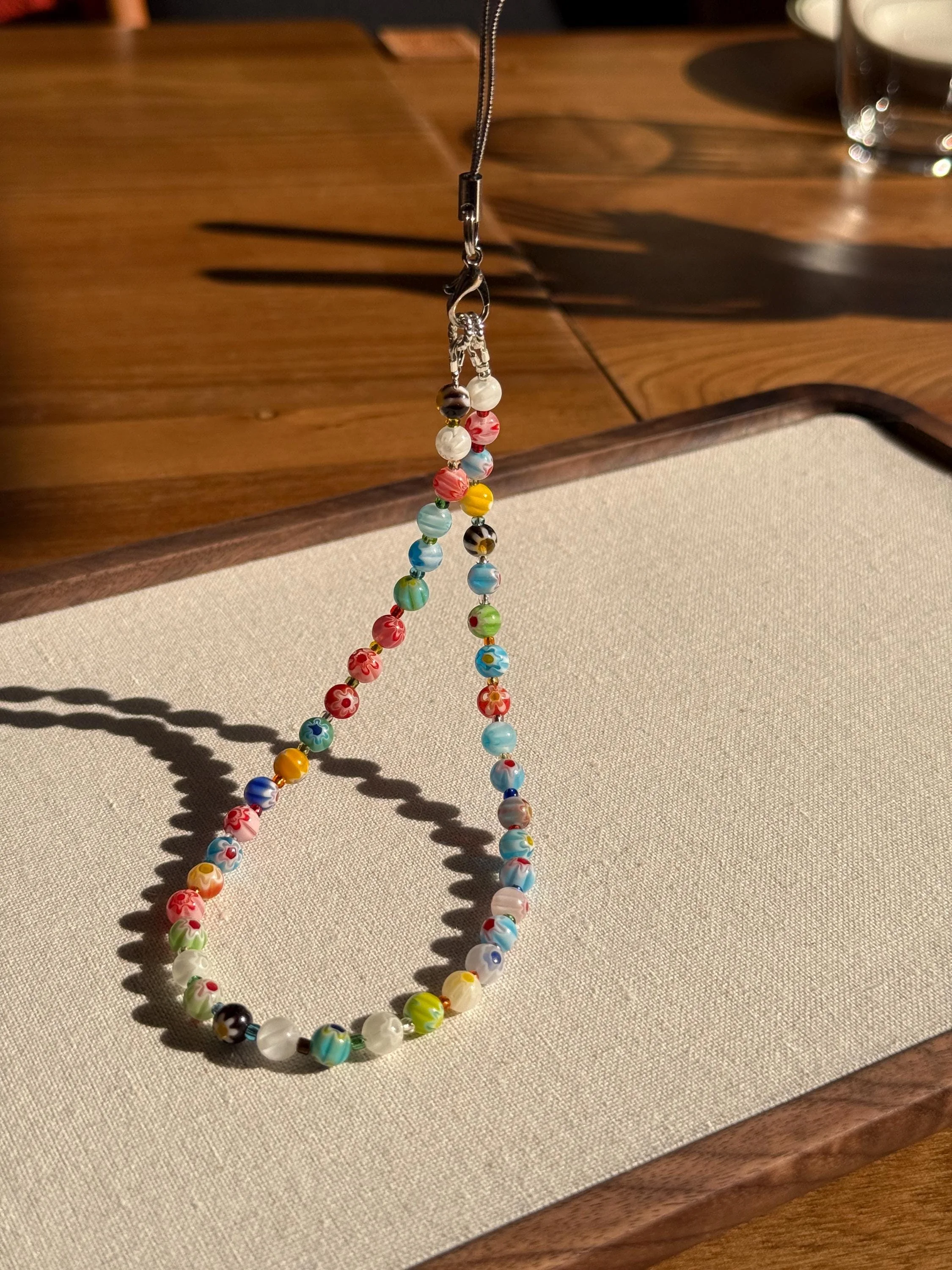 Stained Glass Flower Beaded Phone Charm (Etsy)
