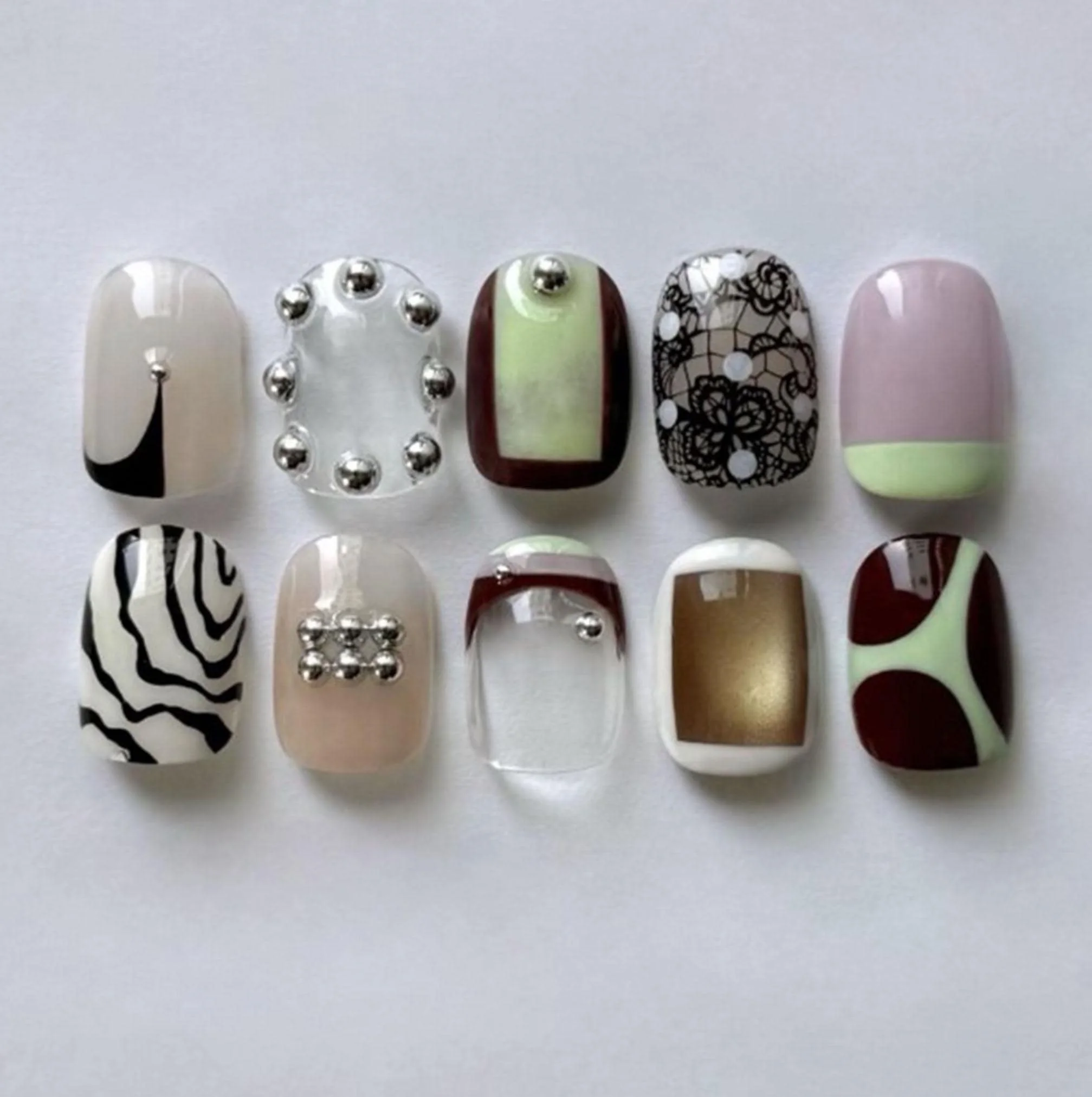 Handmade Mismatched Press-On Nails, 3D Silver Studs (Etsy)