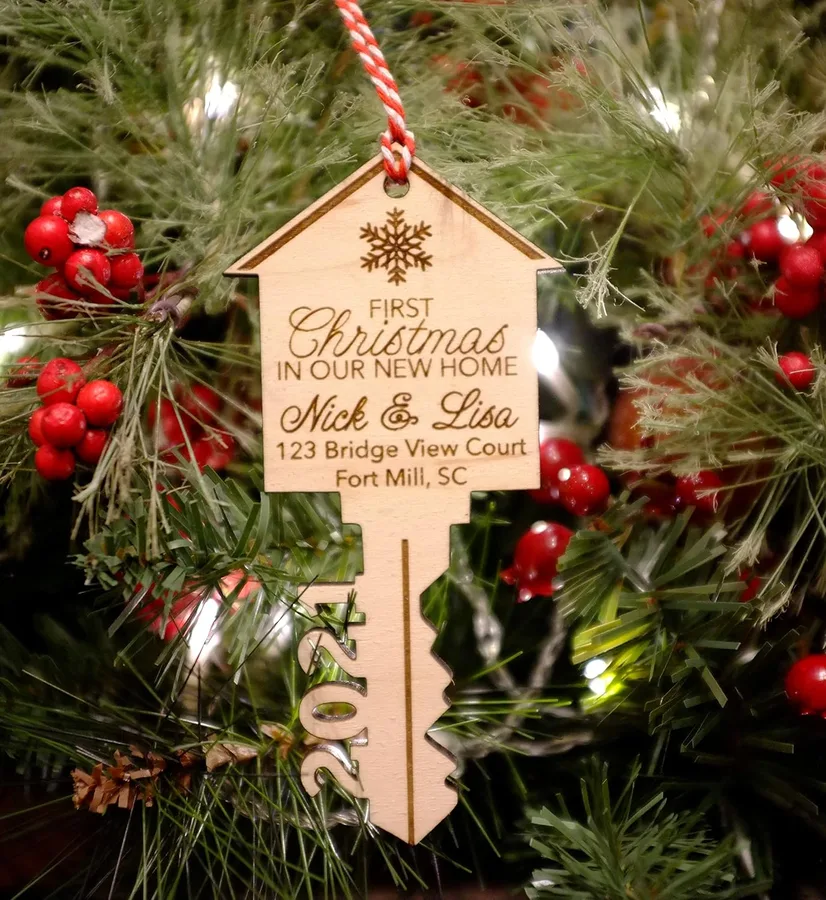 11. 'Our First Home' Personalized Wooden Key Ornament