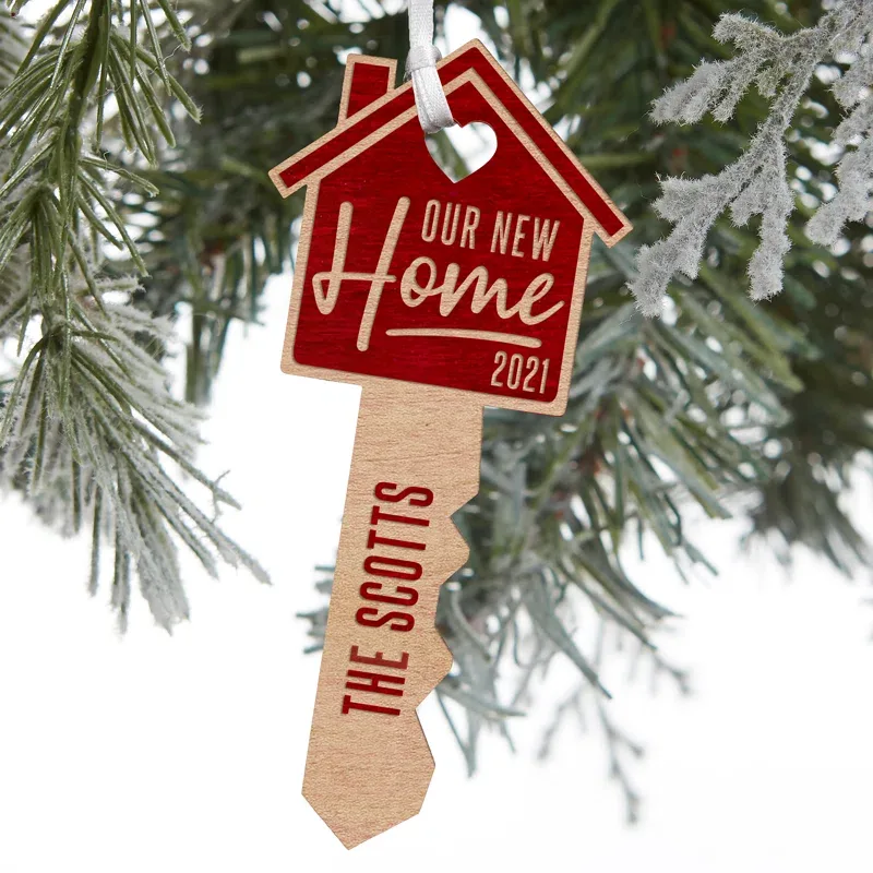 10. 'Our First Home' Engraved Wood Key Ornament (Personalized)